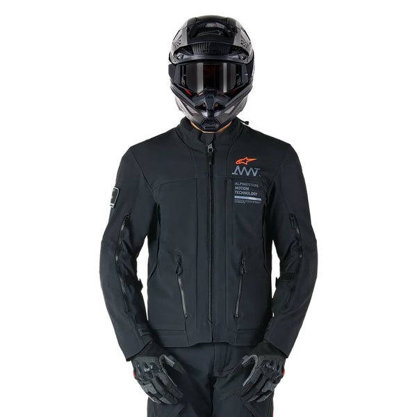 Rider wearing Alpinestars AMT-8 black stretch Drystar XF jacket full riding gear front look