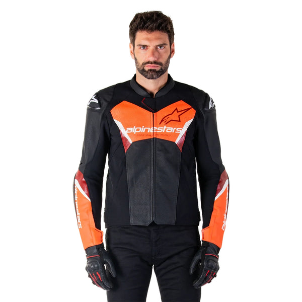 Rider wearing Alpinestars Faster V3 Airflow leather jacket black red summer riding gear front view