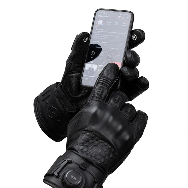 Knox Coniston black motorcycle gloves using smartphone close-up