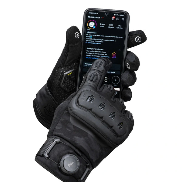 Knox Orsa OR4 Textile black motorcycle glove holding smartphone